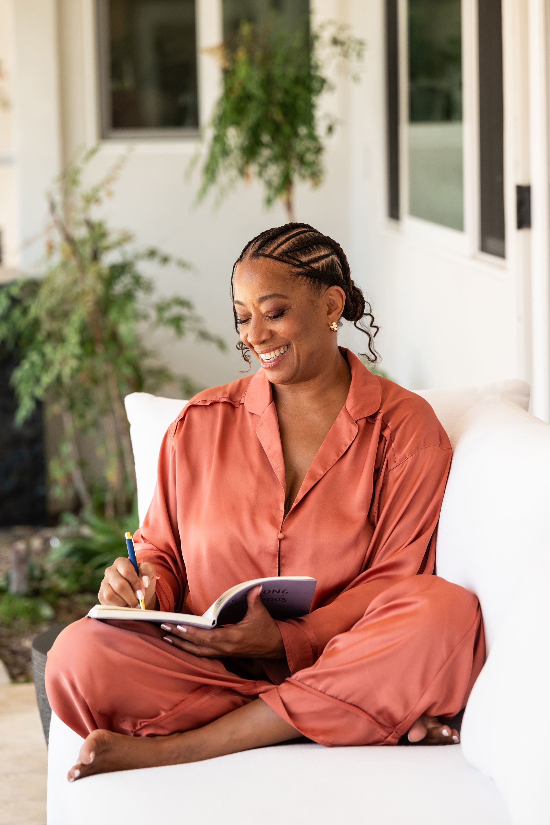 Lisane writing in her journal