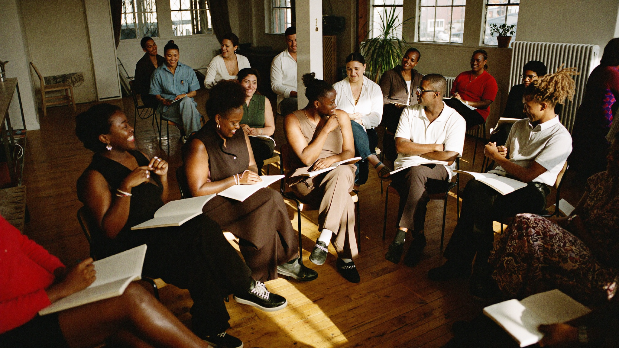 A warm workshop circle in a sunlit loft